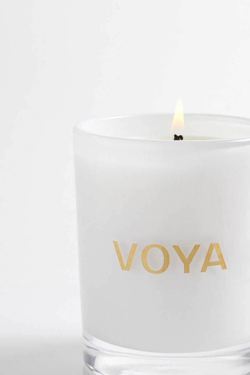 Essential Oil Scented Candle lit with flame, African Lime and Clove Scent, VOYA Skincare USA